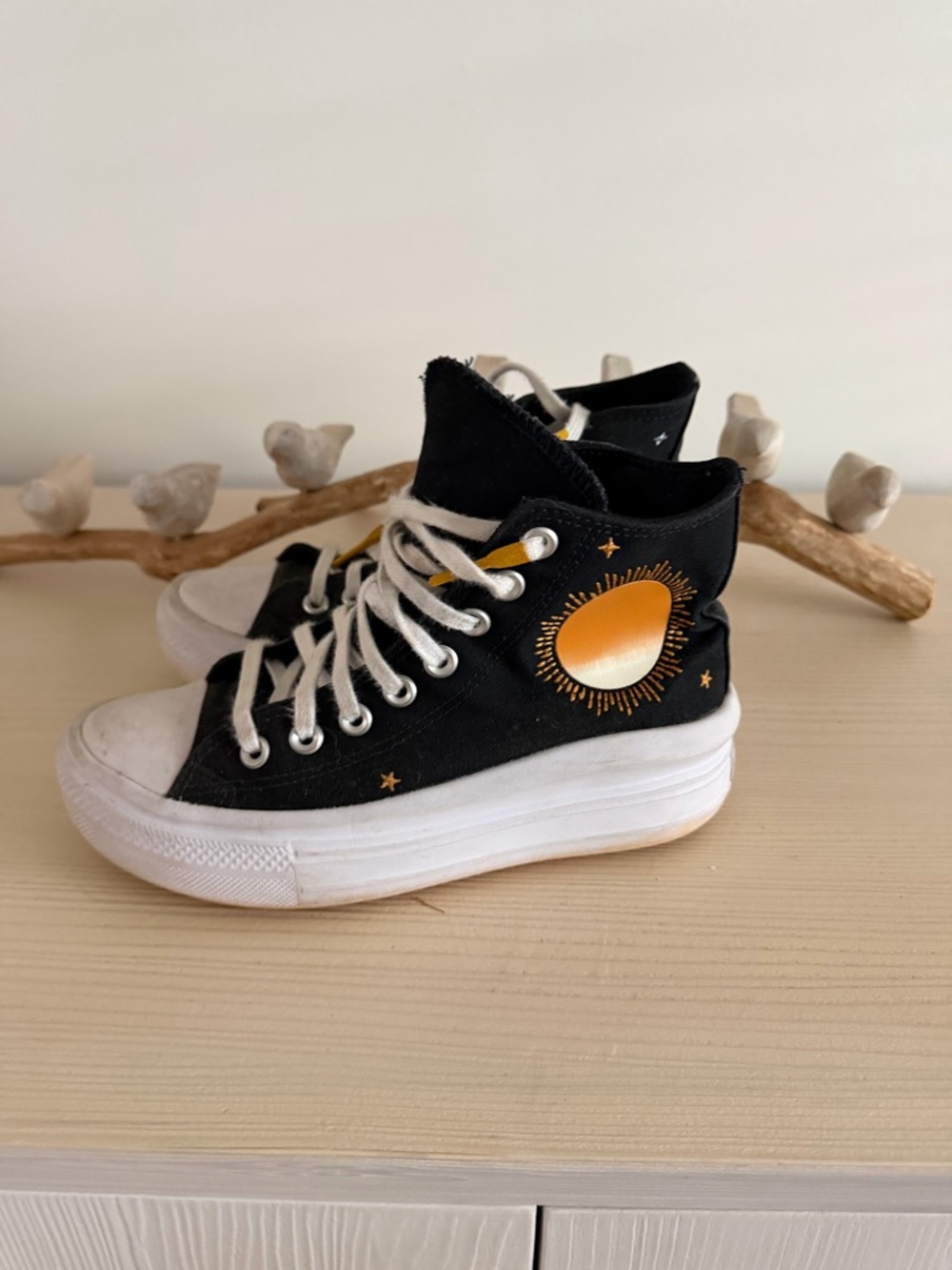 Converses Black High-Top Sneakers with Gold Sun Accent